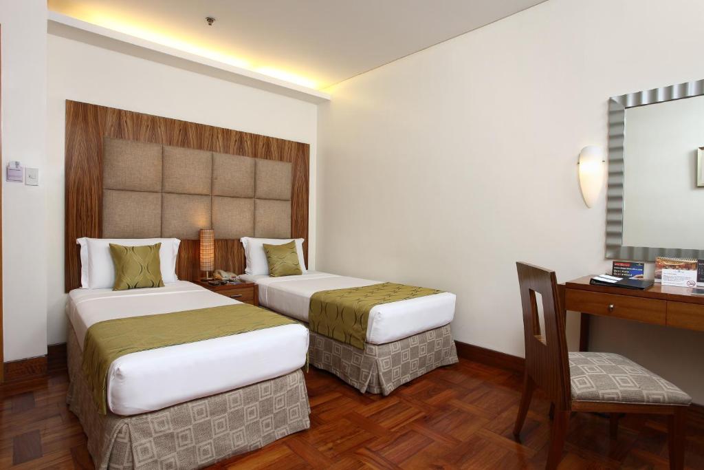 Двухместный (Стандартный двухместный номер с 2 отдельными кроватями, без вида) отеля City Garden Suites, Манила