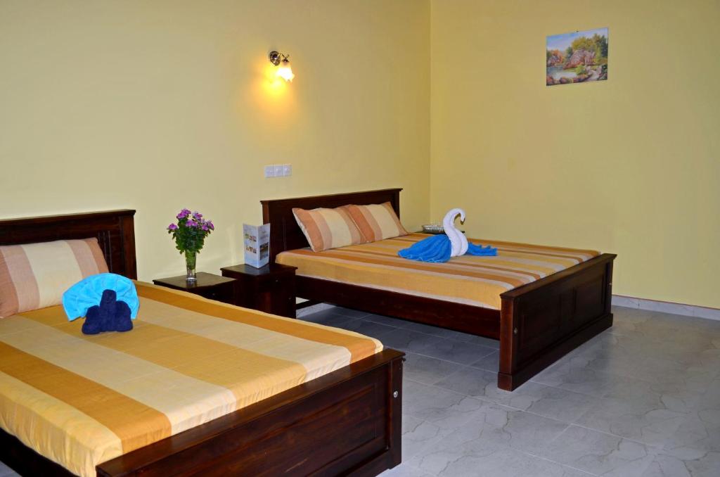 Двухместный (Улучшенный двухместный номер с 1 кроватью или 2 отдельными кроватями) отеля Green Land Villa, Ахангама