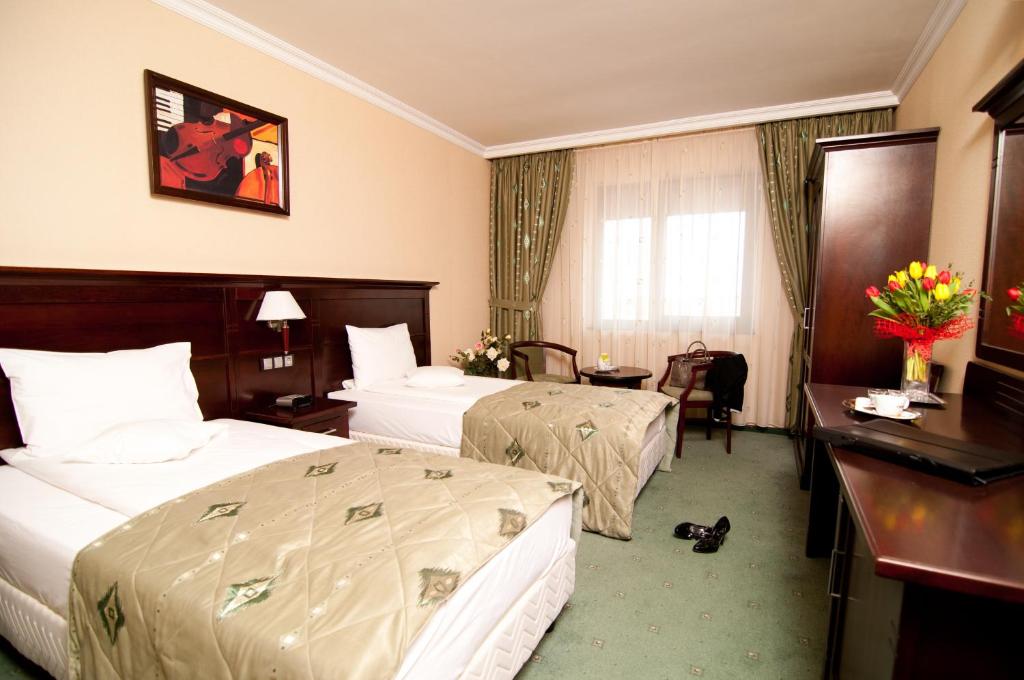 Двухместный (Двухместный номер Делюкс с 1 кроватью или 2 отдельными кроватями) отеля Hotel Rapsodia City Center, Сучава
