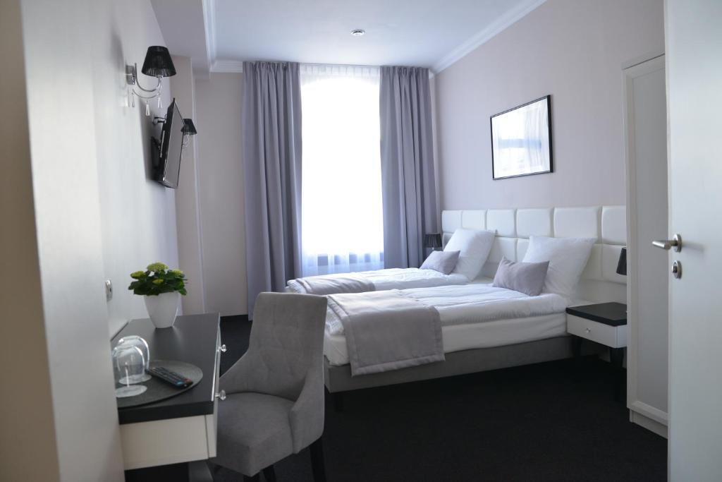 Двухместный (Улучшенный двухместный номер с 2 отдельными кроватями) отеля Hotel Villa Casino, Слубице