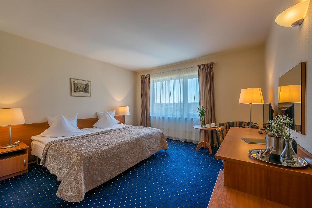 Двухместный (Улучшенный двухместный номер с 1 кроватью или 2 отдельными кроватями) отеля Grata Hotel, Вильнюс