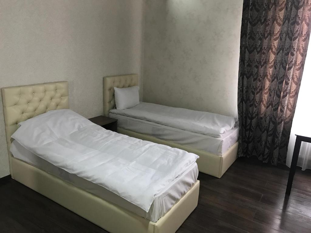 Двухместный (Просторный двухместный номер с 2 отдельными кроватями) отеля Caral, Комрат