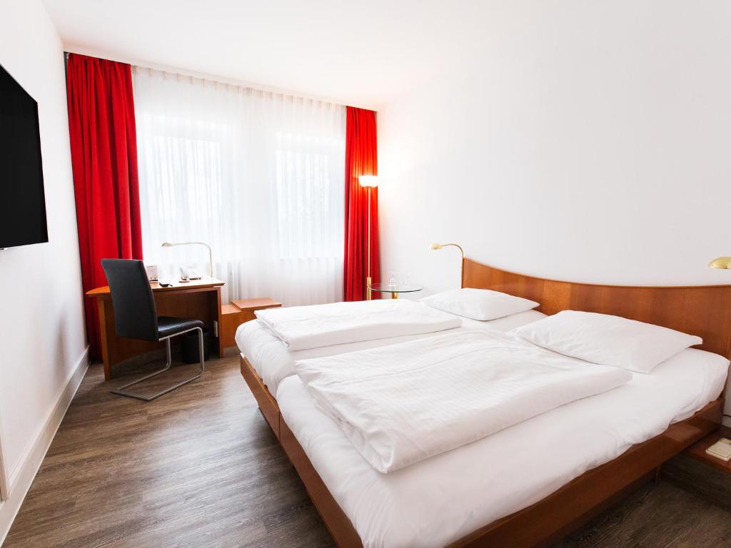 Двухместный (Двухместный номер с 1 кроватью или 2 отдельными кроватями) отеля DORMERO Hotel Dresden Airport, Дрезден