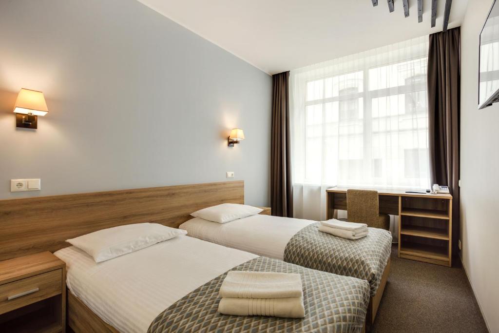 Двухместный (Стандартный двухместный номер с 1 кроватью или 2 отдельными кроватями) отеля Old Town Trio, Вильнюс