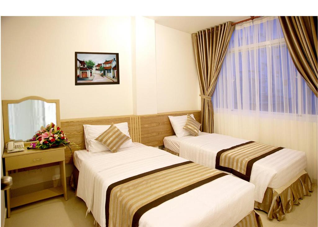 Двухместный (Улучшенный двухместный номер с 1 кроватью или 2 отдельными кроватями) отеля New Sunny Hotel, Хошимин