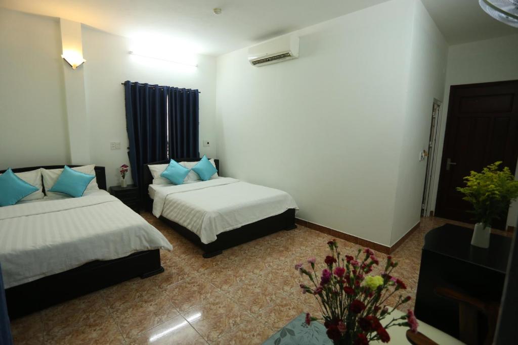 Четырехместный (Номер Делюкс с 2 кроватями размера «queen-size») отеля DaNa Home Hotel - Apartment, Дананг