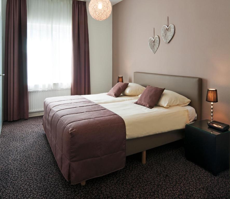 Двухместный (Просторный двухместный номер с 2 отдельными кроватями) отеля Hotel Berg en Dal, Маастрихт