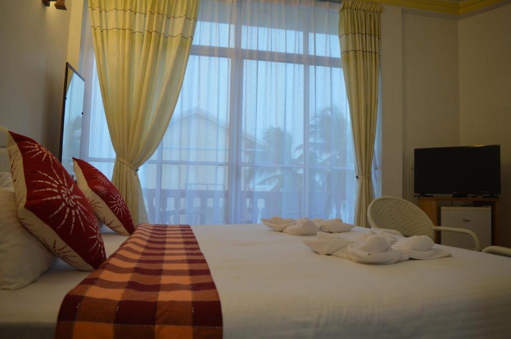 Двухместный (Двухместный номер Делюкс с 1 кроватью и балконом, вид на море) гостевого дома Sun Shine View, Маафуши