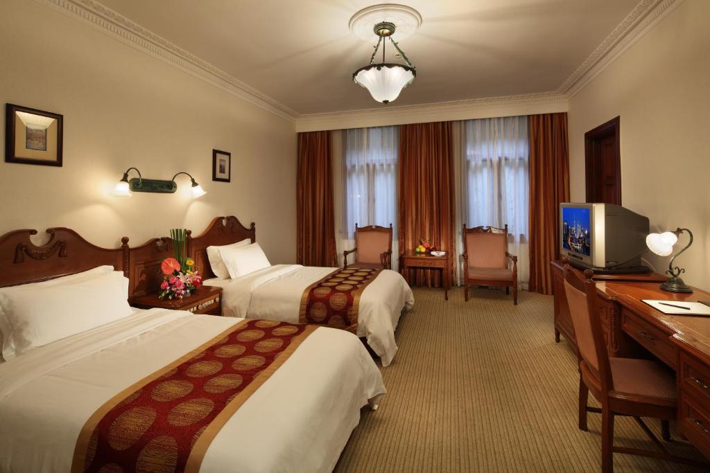 Двухместный (Стандартный двухместный номер с 2 отдельными кроватями) отеля Jin Jiang Pacific Hotel, Шанхай