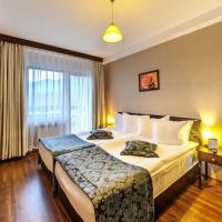 Сьюит (Представительский суперлюкс (для 2 взрослых и 2 детей)) отеля Regnum Bansko Apart Hotel & SPA, Банско