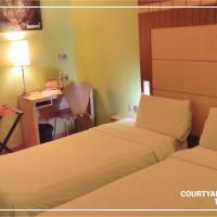 Двухместный (Courtyard Twin Room with No Window) отеля Courtyard Hotel 1Borneo, Кота-Кинабалу