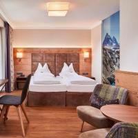 Сьюит (Полулюкс Делюкс) отеля Hotel Neue Post, Майрхофен
