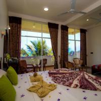 Трехместный (Deluxe Triple Room with Sea View - 24-Hours Check-Out from the Time of Check-in based on Availability & Free Upgrade to Half Board Meal Plan for Stays of 10 Nights or More) отеля Hotel Coconut Bay, Калутара