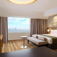 Сьюит (Номер-студио с кроватью размера "king-size" и мини-кухней) отеля Holiday Inn & Suites Jakarta Gajah Mada, Джакарта