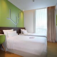Двухместный (Happiness Twin Room) отеля MaxOneHotels.com at Pemuda, Джакарта