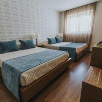 Четырехместный (Семейный номер (для 4 взрослых)) отеля Hotel Nossa Senhora de Lurdes, Фатима