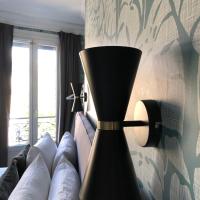 Двухместный (Улучшенный двухместный номер с 1 кроватью или 2 отдельными кроватями, вид на город) отеля Hôtel Prony, Париж