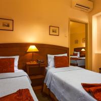 Четырехместный (Четырехместный номер) отеля Vera Cruz Porto Downtown Hotel, Порту