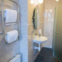 Четырехместный (Улучшенный четырехместный номер) отеля Slottshotellet, Кальмар