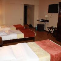 Четырехместный (Четырехместный номер) отеля Green Plaza Inn, Александрия